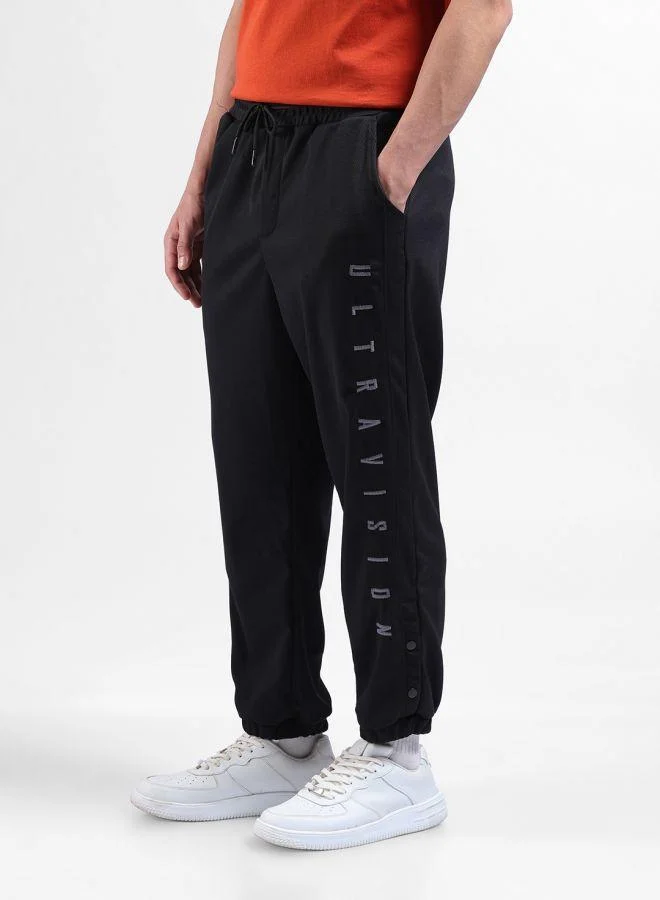 The Indian Garage Co  Men Relaxed Fit Embroidered Side Pocket Mid-Rise Joggers for Men | Best Price UAE